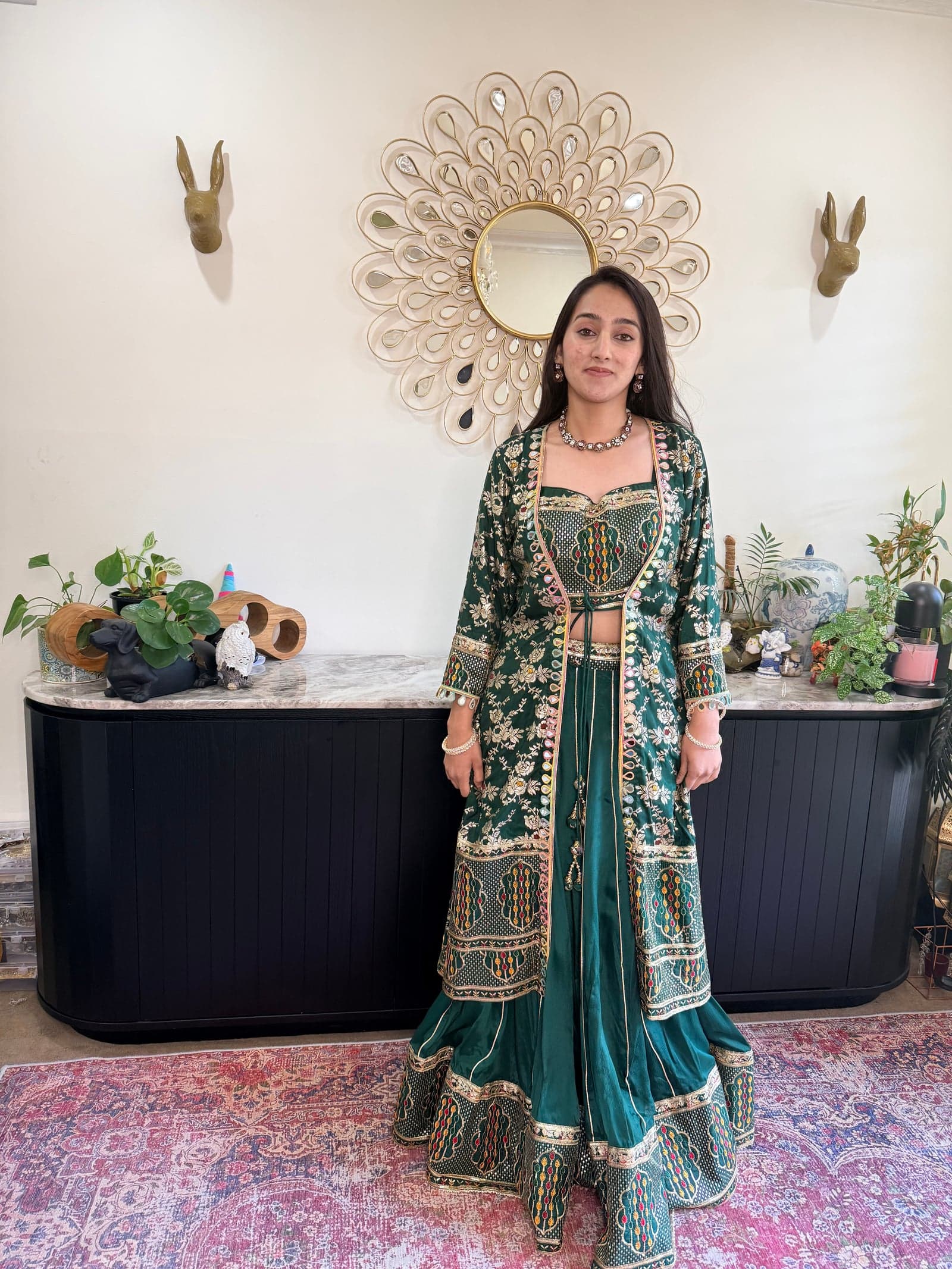 Emerald green lehenga set with tilfi-zari embroidery, Banaras kadhua technique