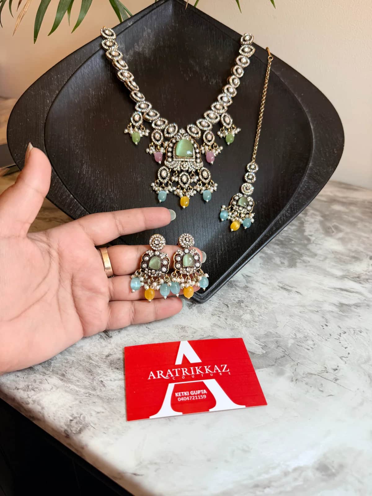 Kundan Necklace Set with Mint & Pink Stones front view on model