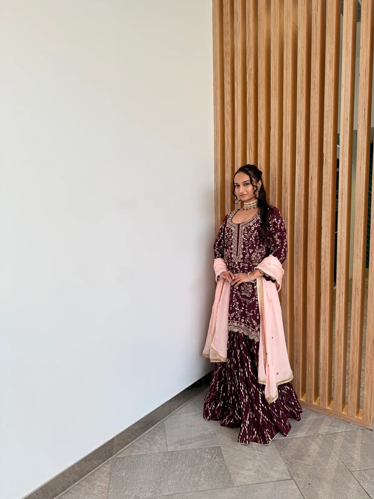 Wine Hand-Embroidered Lehenga Suit with Contrast Dupatta front view on model
