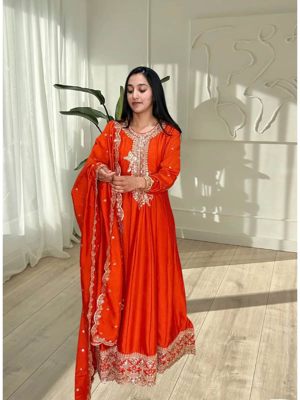 Orange Embroidered Anarkali Suit with Scalloped Dupatta front view on model
