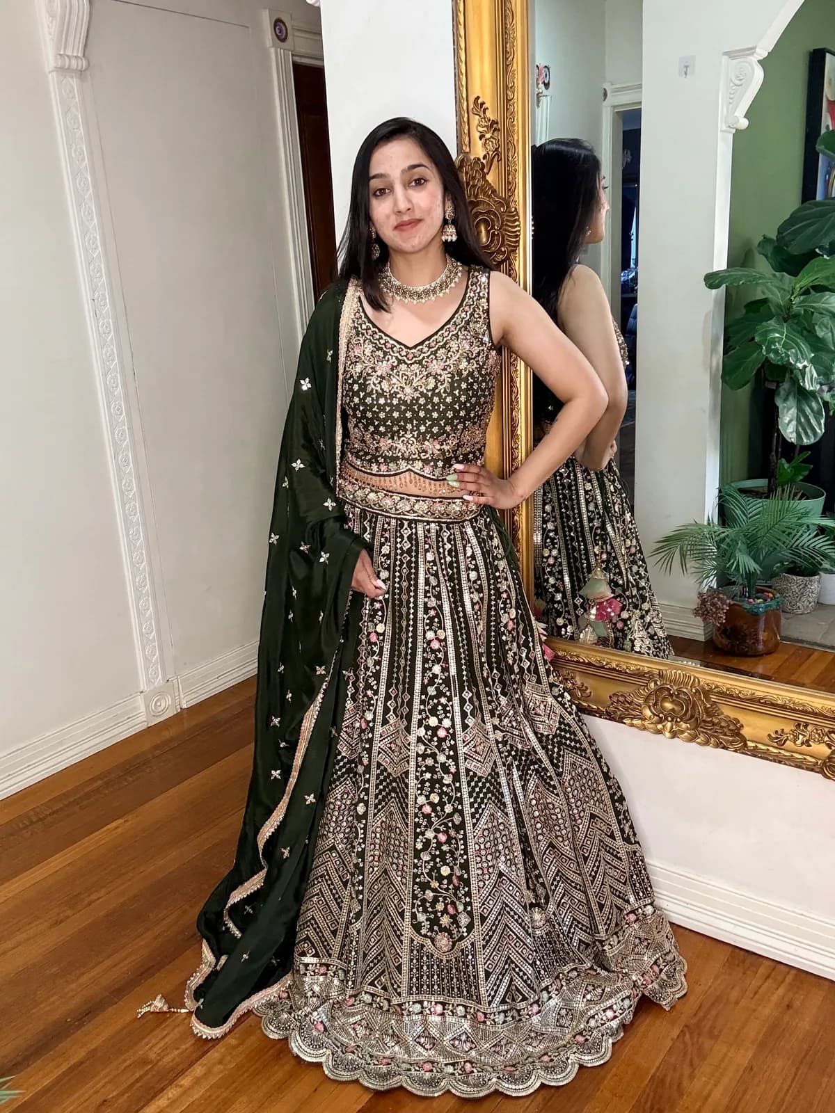 Bottle Green Sequin and Resham Embroidered Lehenga Set front view on model