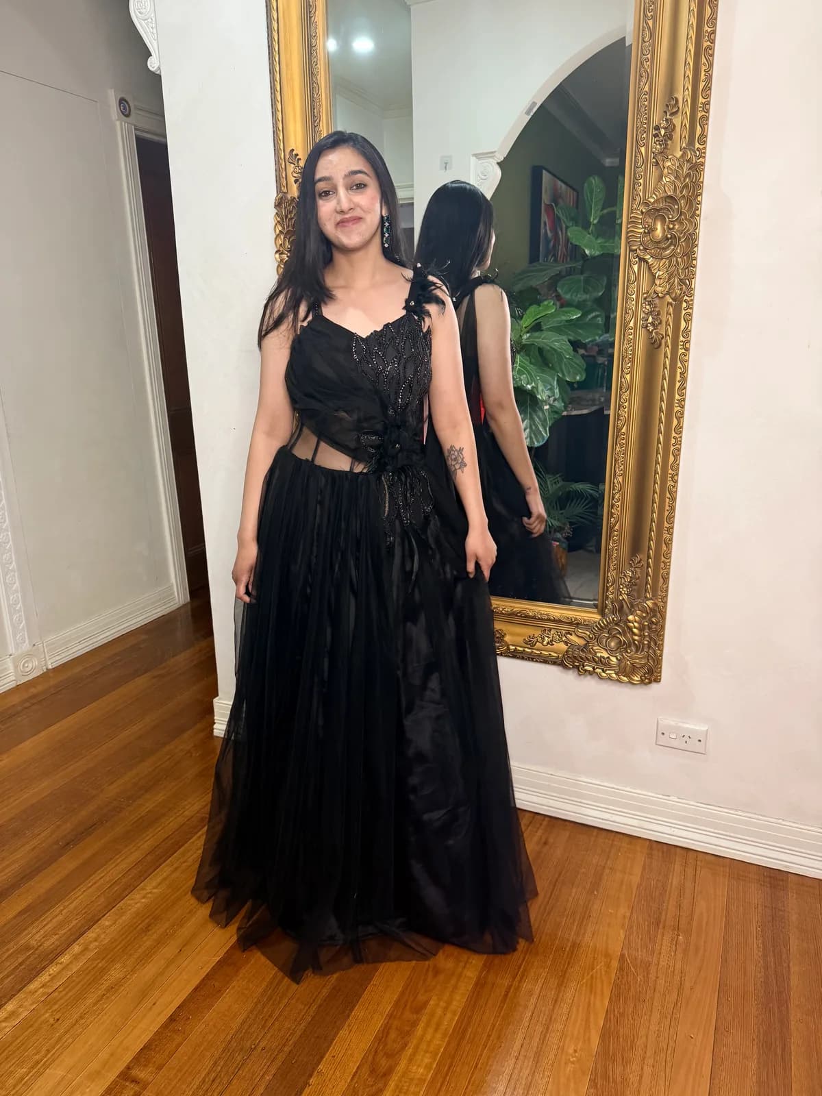 Black Hand-Embroidered Choli with Floor-Length Tulle Gown front view on model