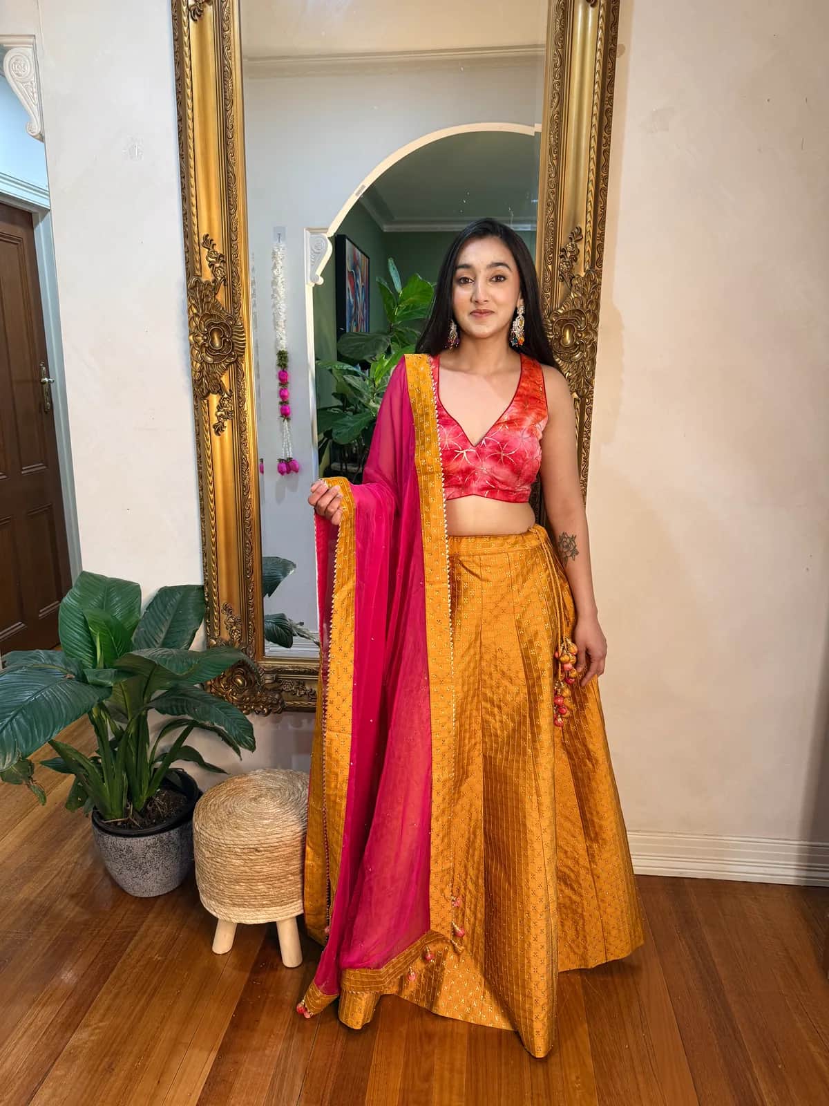 Mustard Banarasi Lehenga with Coral Sequin Choli front view on model